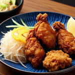 **

A delicious-looking plate of "Karaage" (Japanese fried chicken) made with soy meat. Focus on a close-up shot to highlight the texture and golden-brown color. Include some typical Japanese side dishes like shredded cabbage and lemon wedges. The overall feel should be appetizing and inviting, suggesting a healthy yet satisfying meal.

**