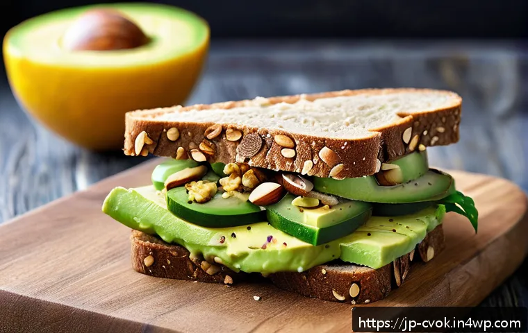 대체 단백질 요리법으로 만드는 샌드위치 아이디어 - A vibrant, close-up shot of a healthy sandwich featuring creamy mashed avocado lightly brushed with ...