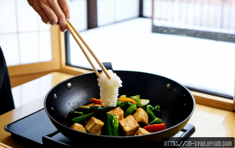 비건 요리에서의 대체 단백질 활용 사례 - Photorealistic Japanese home kitchen, a vibrant vegan tofu and vegetable stir-fry being prepared in ...